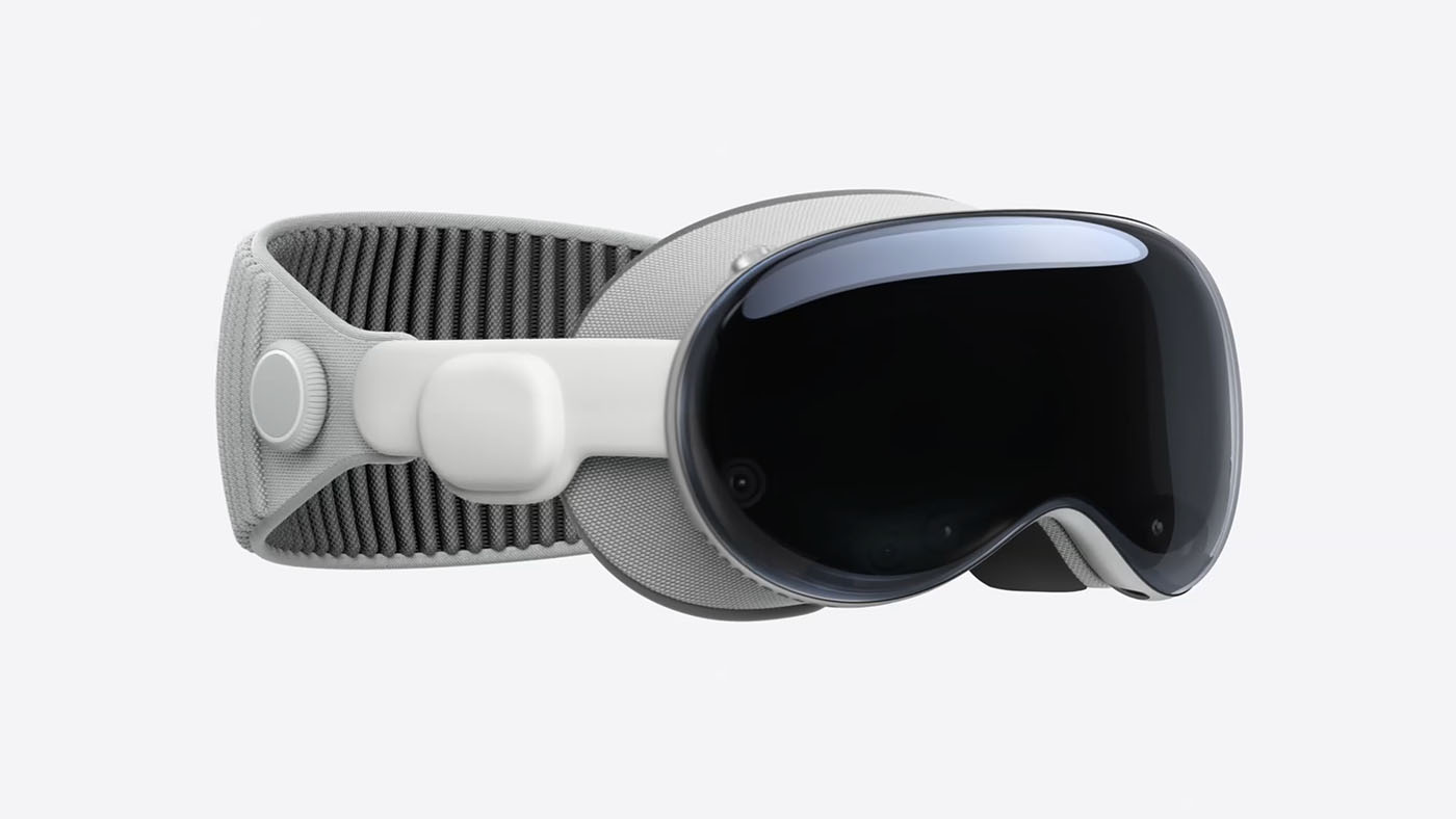 Apple Vision Pro smart glasses viewed from the side against a grey void.
